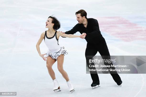 Liubov Ilyushechkina and Dylan Moscovitch of Canada compete in the Pairs Short Program during day one of the World Figure Skating Championships at...