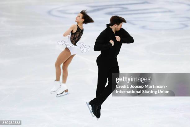 Liubov Ilyushechkina and Dylan Moscovitch of Canada compete in the Pairs Short Program during day one of the World Figure Skating Championships at...