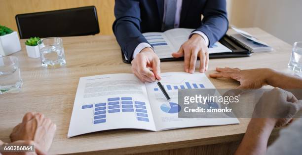 banker discussing with couple - investment planning stock pictures, royalty-free photos & images