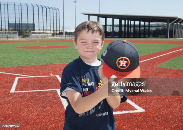Eight year old Cancer survivor Andrew Dawson throws a pitch at Astros Pitcher Lance McCullers during a day in the Life of the Astros at The Ballpark...
