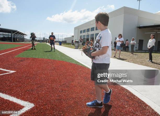 Eight year old Cancer survivor Andrew Dawson throws a pitch at Astros Pitcher Lance McCullers during a day in the Life of the Astros at The Ballpark...