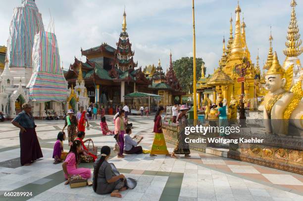 People worshipping at the 2,500 years old Shwedagon Pagoda in Yangon , the largest city in Myanmar.