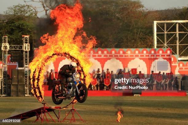 Indian army jawan showing his skills during the Army Pageant &amp; Air Force Show on the eve of Rajasthan day celebration at Polo Ground in Jaipur on...