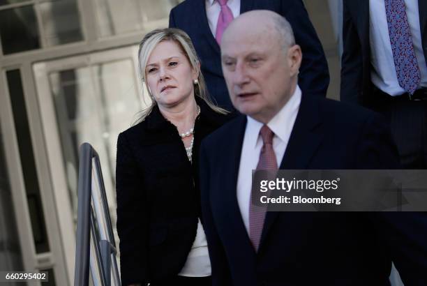Bridget Anne Kelly, former deputy chief of staff for New Jersey Governor Chris Christie, left, exits federal court after sentencing in Newark, New...