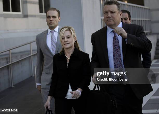 Bridget Anne Kelly, former deputy chief of staff for New Jersey Governor Chris Christie, center, exits federal court after sentencing in Newark, New...