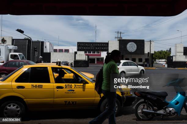 Pedestrian passes in front of the Nayarit State Attorney Generals headquarters in Tepic, Mexico, on Wednesday, March 29, 2017. On Wednesday, Nayarit...