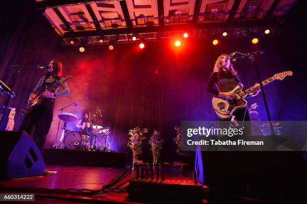 Theresa Wayman, Stella Mozgawa and Emily Kokal of Warpaint perform at Brighton Dome on March 29, 2017 in Brighton, England.