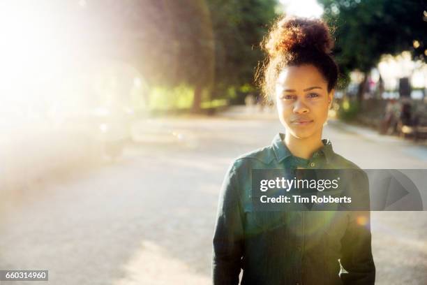 woman looking at camera - facial expressions series stock pictures, royalty-free photos & images