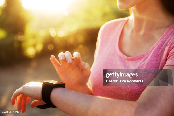 woman with smart watching, close up - exercise watch stock pictures, royalty-free photos & images