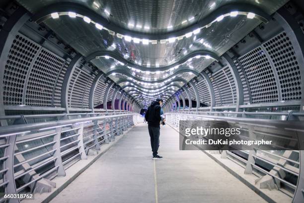 pedestrian overpass - airport lights stock pictures, royalty-free photos & images