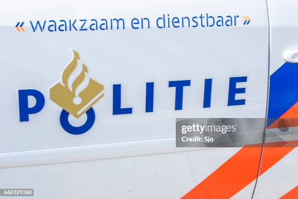 police - politie in dutch on the front of a police car - politie nederland stock pictures, royalty-free photos & images