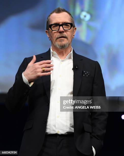 Actor Gary Oldman speaks onstage at Focus Features luncheon and studio program celebrating 15 Years during CinemaCon at The Colosseum at Caesars...