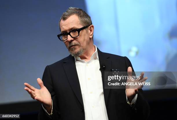 Actor Gary Oldman speaks onstage at Focus Features luncheon and studio program celebrating 15 Years during CinemaCon at The Colosseum at Caesars...