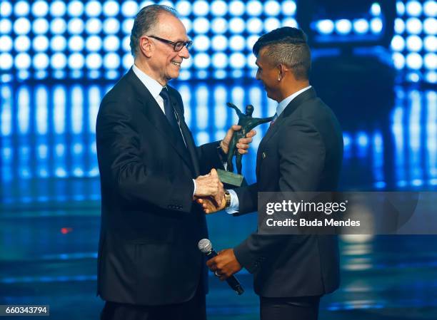 Brazilian Olympic Committee president Carlos Arthur Nuzman awards Canoe Sprint Isaquias Queiroz, the Best Male Athlete of 2016 during the ceremony of...