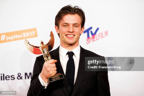 Jannis Niewoehner poses with his award at the Jupiter Award at Cafe Moskau on March 29, 2017 in Berlin, Germany.