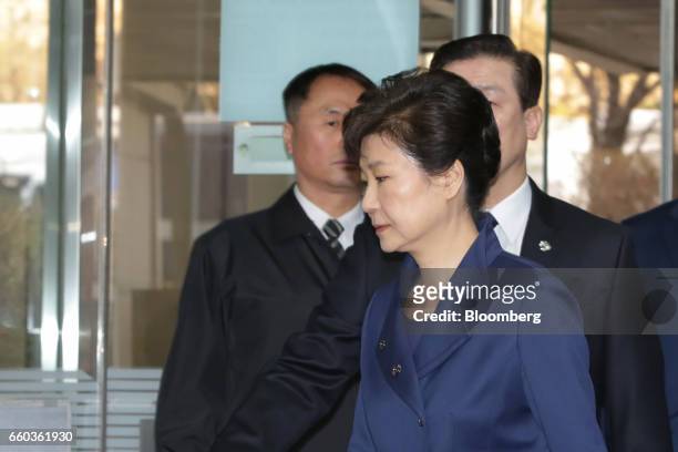 Park Geun-hye, former president of South Korea, front right, arrives at the Seoul Central District Court in Seoul, South Korea, on Thursday, March...