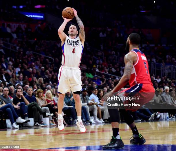 Redick of the LA Clippers shoots a three in front of Markieff Morris of the Washington Wizards during a 133-124 Clipper win at Staples Center on...