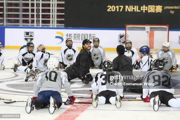 Young Chinese hockey players participate learn to play Youth Hockey Clinic during the NHL announcement in China at LeSports Center on March 30, 2017...