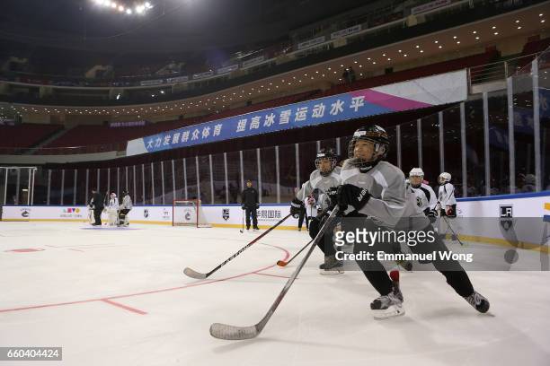 Young Chinese hockey players participate learn to play Youth Hockey Clinic during the NHL announcement in China at LeSports Center on March 30, 2017...