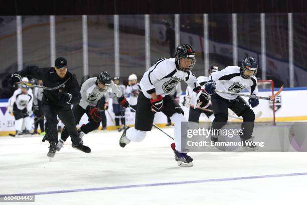 Young Chinese hockey players participate learn to play Youth Hockey Clinic during the NHL announcement in China at LeSports Center on March 30, 2017...