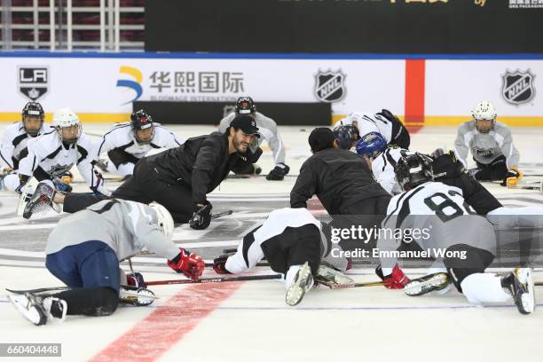 Young Chinese hockey players participate learn to play Youth Hockey Clinic during the NHL announcement in China at LeSports Center on March 30, 2017...