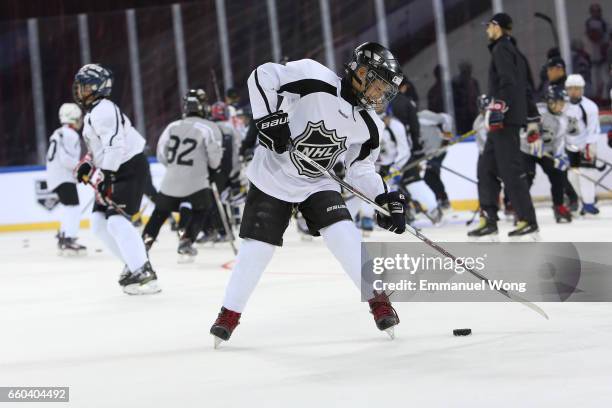 Young Chinese hockey players participate learn to play Youth Hockey Clinic during the NHL announcement in China at LeSports Center on March 30, 2017...