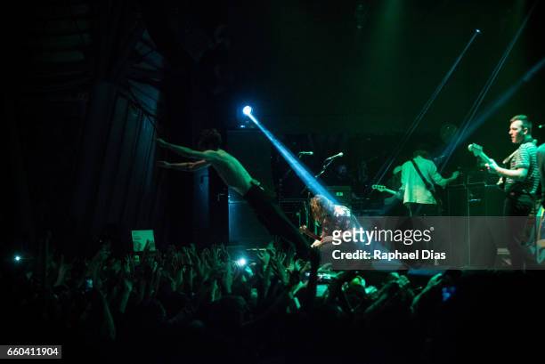 Matt Schultz jumps on stage during Cage The Elephant performance at Circo Voador on March 29, 2017 in Rio de Janeiro, Brazil.