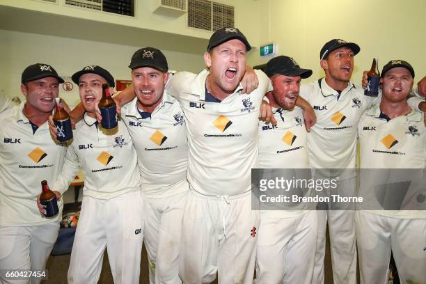Victorian Bushrangers celebrate in the change rooms after claiming the Sheffield Shield following the Sheffield Shield final between Victoria and...