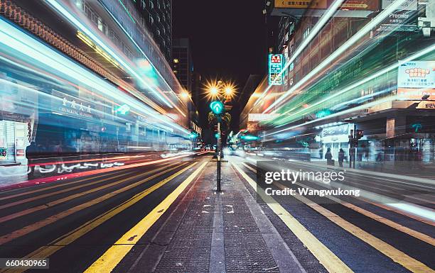 fast lane in hongkong - light trail people stock pictures, royalty-free photos & images