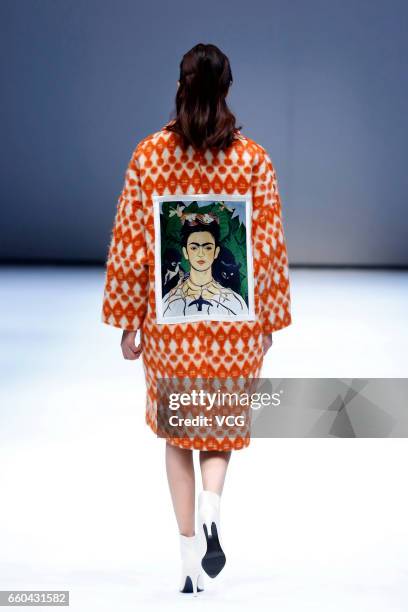 Model showcases designs on the runway at JD & UYEN collection by designer Han Dongyang during Mercedes-Benz China Fashion Week Autumn/Winter...