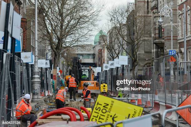Dublin's Dawson Street looks like a construction site with the ongoing works of the Luas Cross City project, with the existing Luas Green Line beeing...
