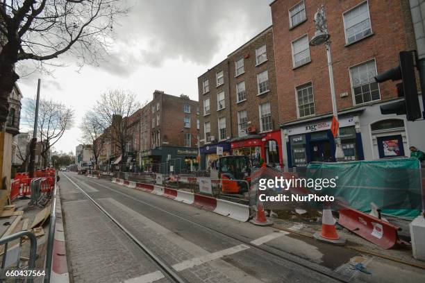 Dublin's Dawson Street looks like a construction site with the ongoing works of the Luas Cross City project, with the existing Luas Green Line beeing...
