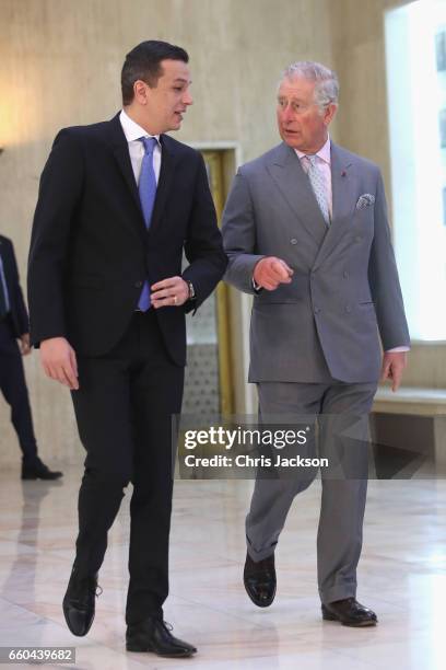 Prince Charles, Prince of Wales is greeted by Romanian Prime Minister Sorin Grindenau as he visits the Palatul Victoria, the office of the Prime...