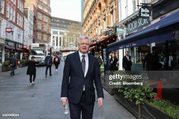 David Davis, U.K. Exiting the European Union secretary, walks through the Leicester Square district after giving a television interview in London,...