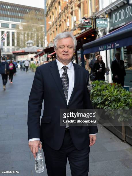 David Davis, U.K. Exiting the European Union secretary, walks through the Leicester Square district after giving a television interview in London,...