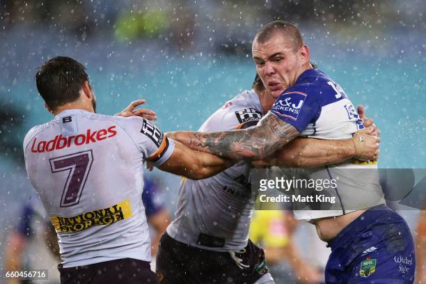 David Klemmer of the Bulldogs is tackled during the round five NRL match between the Canterbury Bulldogs and the Brisbane Broncos at ANZ Stadium on...