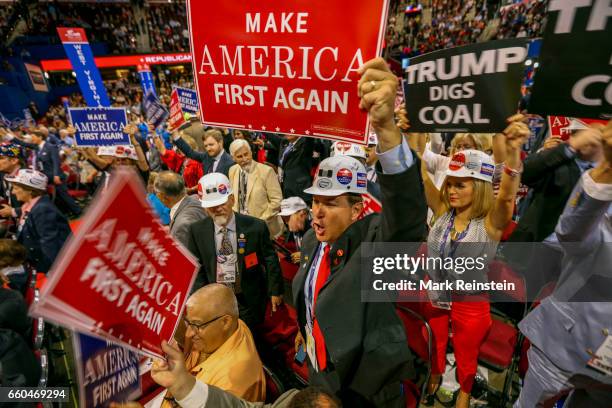 View of West Virginia Republican delegates, many with signs, as they stand on main floor of the Quicken Arena on the third day of the Republican...