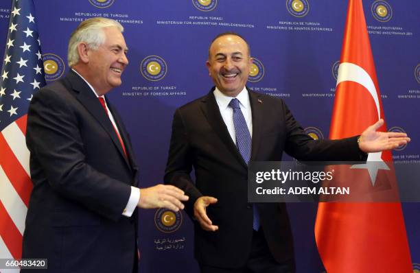 Turkish Foreign Minister Mevlut Cavusoglu gestures to US Secretary of State Rex Tillerson in Ankara on March 30, 2017. US Secretary of State Rex...