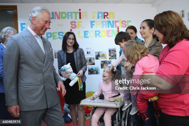 Prince Charles, Prince of Wales visits the FARA Foundation in Popesti Leordeni and meets young people and children housed by the charity, as well as...