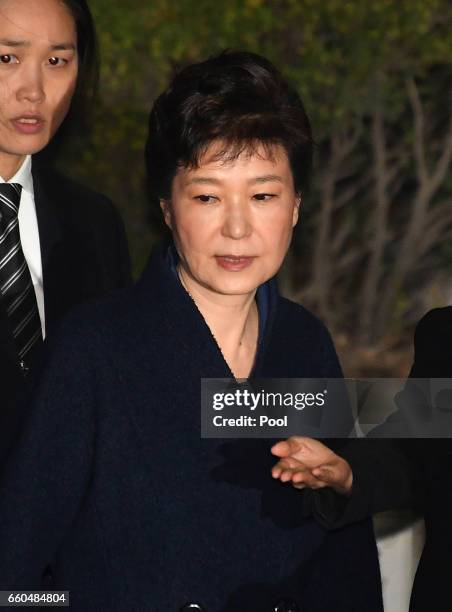 Ousted South Korean President Park Geun-hye, leaves after hearing on a prosecutors' request for her arrest for corruption at the Seoul Central...