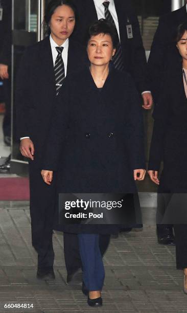 Ousted South Korean President Park Geun-hye, leaves after hearing on a prosecutors' request for her arrest for corruption at the Seoul Central...