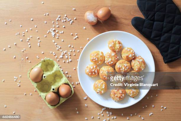 freshly baked chouquettes - choux pastry stock pictures, royalty-free photos & images