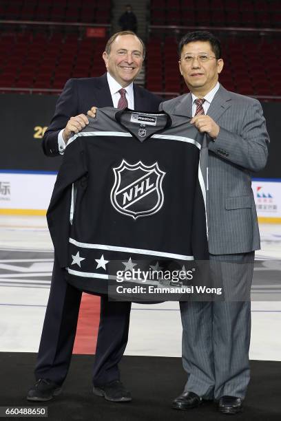Commissioner Gary Bettman and director of Sports Bereau of Haidian District Li Jingqi attend the NHL Announcement in China at LeSports Center on...
