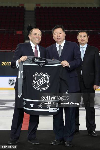 Commissioner Gary Bettman and deputy director of Beijing Sports Bureau Chen Jie attend the NHL Announcement in China at LeSports Center on March 30,...