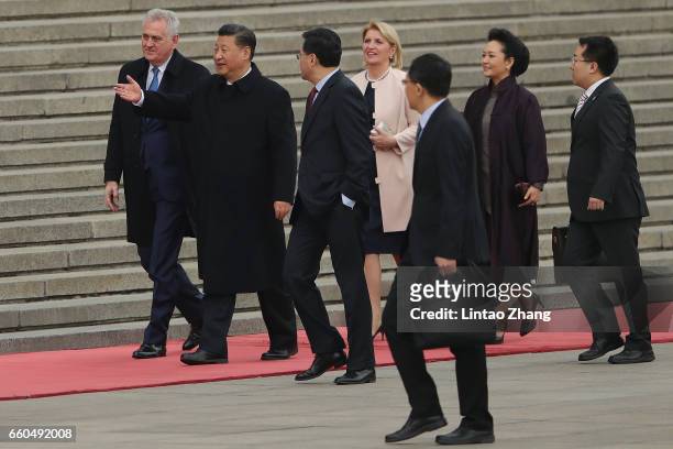 Chinese President Xi Jinping invites Serbian President Tomislav Nikolic to view a guard of honour during a welcoming ceremony outside the Great Hall...