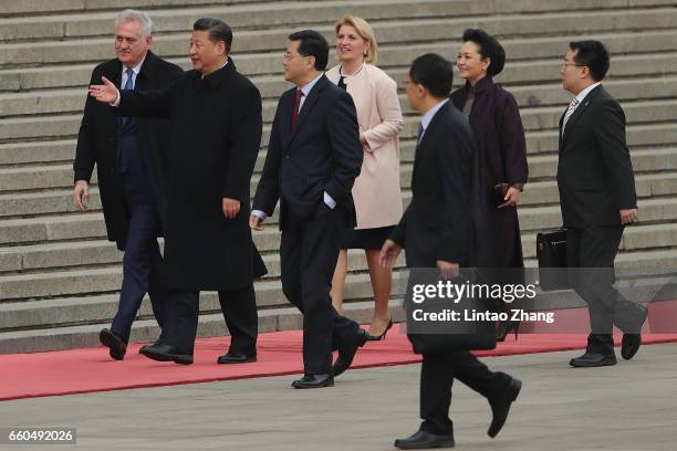 Chinese President Xi Jinping invites Serbian President Tomislav Nikolic to view a guard of honour during a welcoming ceremony outside the Great Hall...