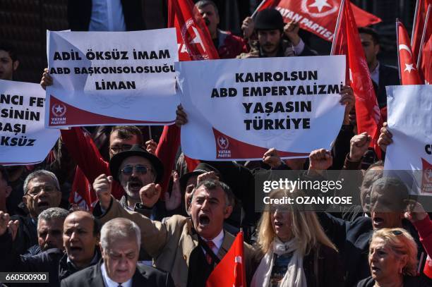 Supporters of the Vatan Partisi shout slogans and hold signs reading "Damn American imperialism, you can not seperate our country" during a...