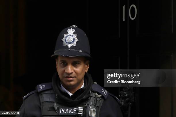 British Police officer leaves number 10 Downing Street in London, U.K., on Thursday, March 30, 2017. U.K. Prime Minister Theresa May will begin to...