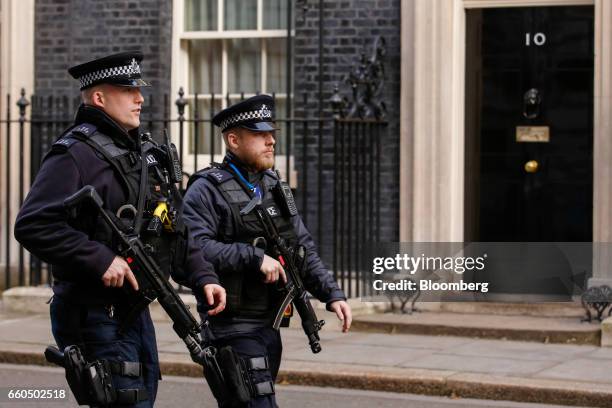 Armed British Police offices pass number 10 Downing Street in London, U.K., on Thursday, March 30, 2017. U.K. Prime Minister Theresa May will begin...