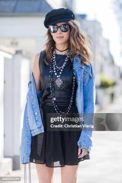 Model and fashion blogger Alexandra Lapp wearing the Fergie dress from Tigha with a leather top and pleating skirt, a wide leather waist belt from...